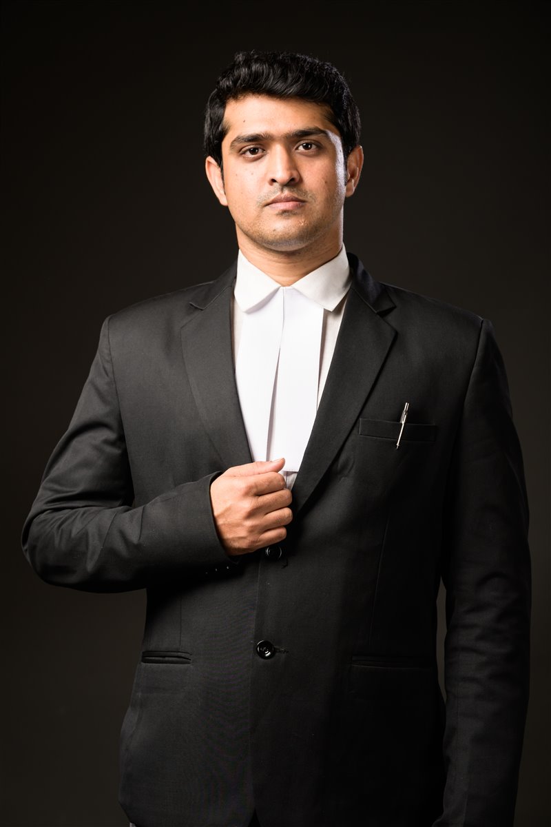 One of the ARS LAW founding advocates seated in a formal studio portrait.